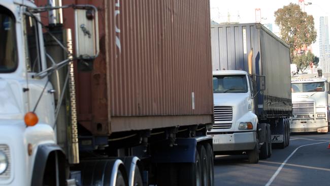 Trucks, pictured in Footscray, and poorly-sealed roads are being blamed for bad air quality.