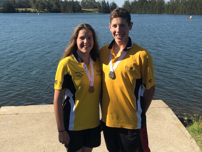 Madeline Franjic and Matthew Galea from the Blacktown City Swimming Club with their medals from the state open water competition.