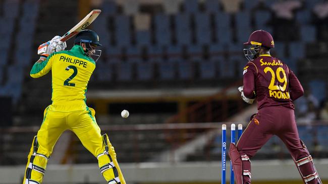 Josh Philippe is bowled by Hayden Walsh Jr. in the second T20I. Picture: Randy Brook/AFP