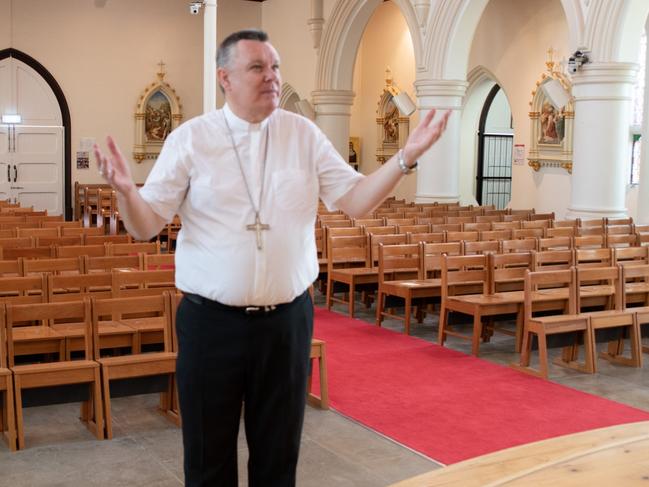 Townsville Bishop Tim Harris closing the Church doors at Sacred Heart Cathedral in line with new social distancing rules as Coronavirus (COVID-19) hits.