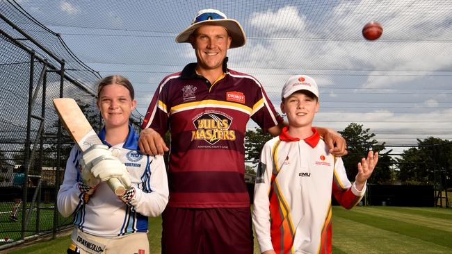 Queensland Bulls Masters player Charlie Hemphrey with Brooke Morrish, 12, and Ben Taylor, 12, at Riverway stadium. Picture: Evan Morgan