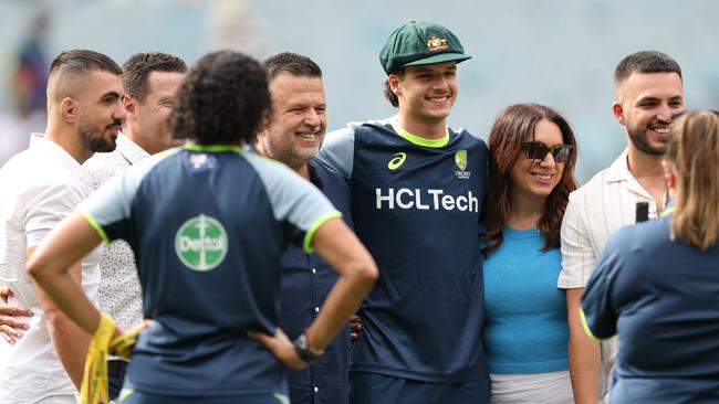 Show-stealing Boxing Day debutant Sam Konstas was presented his baggy green with his dad Jim (left), mum Pam (right) and brothers Billy and Johnny. Picture: Robert Cianflone / Getty Images