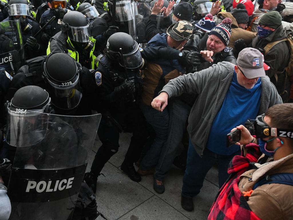 Riot police push back a crowd of supporters of US President Donald Trump after they stormed the Capitol building on January 6 in Washington, D.C. Picture: Roberto Schmidt/AFP