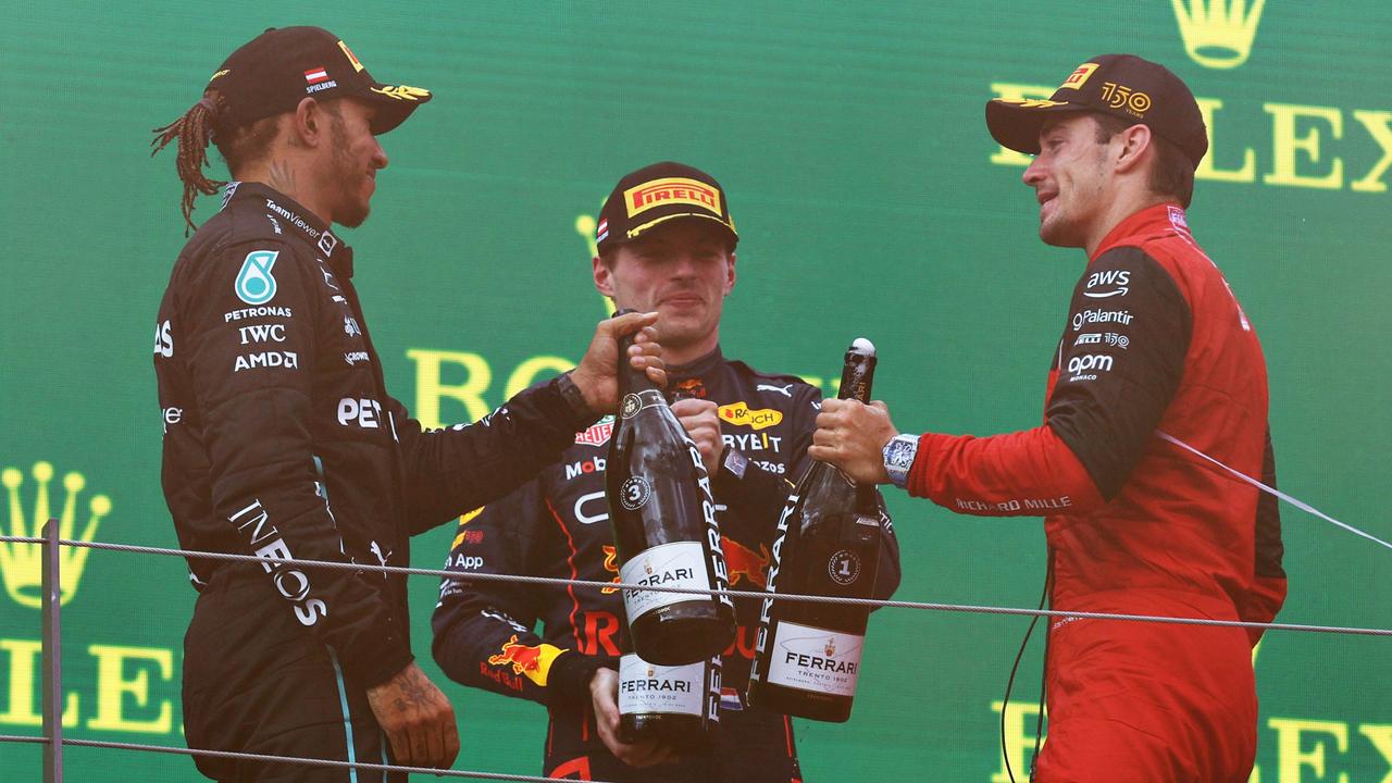 SPIELBERG, AUSTRIA - JULY 10: Race winner Charles Leclerc of Monaco and Ferrari, Second placed Max Verstappen of the Netherlands and Oracle Red Bull Racing and Third placed Lewis Hamilton of Great Britain and Mercedes celebrate on the podium during the F1 Grand Prix of Austria at Red Bull Ring on July 10, 2022 in Spielberg, Austria. (Photo by Clive Rose/Getty Images)