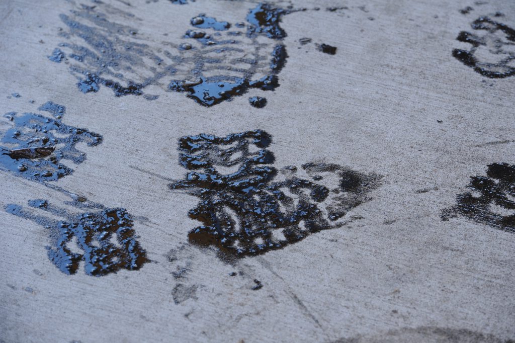 Footprints of thick black oil mixed with the flood waters in the CBD. Photo: Robyne Cuerel / Fraser Coast Chronicle. Picture: Robyne Cuerel