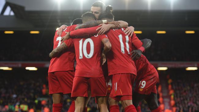 Liverpool's Senegalese midfielder Sadio Mane (R) celebrates scoring his team's fifth goal.