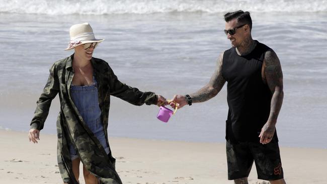 Pink on the beach with husband Carey Hart. Picture: Matrix