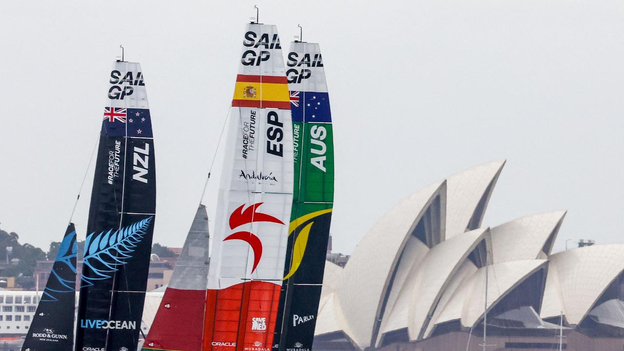 The crews of Team New Zealand, Team Spain and Team Australia sail in front of the Sydney Opera House during the Sydney SailGP. Picture: SailGP