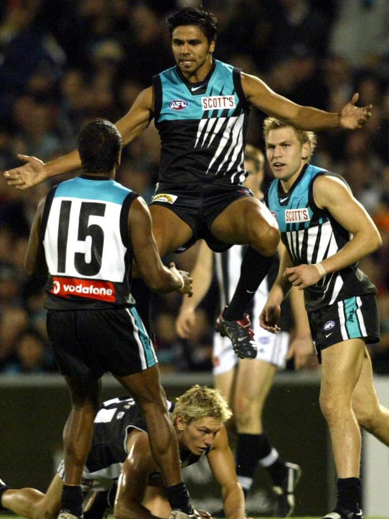 Cockatoo-Collins celebrates a goal with teammates in 2003. Picture: Advertiser Files