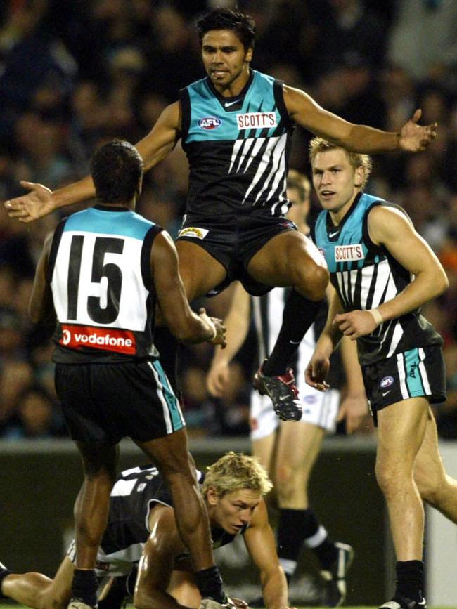 Cockatoo-Collins celebrates a goal with teammates in 2003. Picture: Advertiser Files