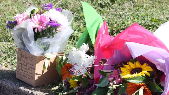 Floral tributes outside of Phoebe Bishop’s share house in Gin Gin. Picture: Liam Kidston.
