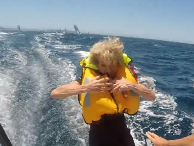 Julie Bishop, jumps off the back of Wild Oats X. Picture: Craig Greenhill