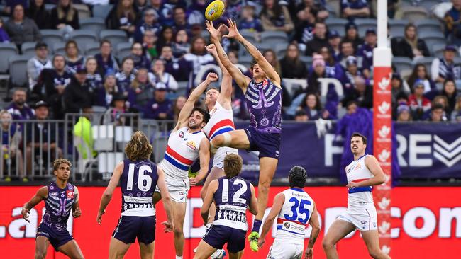 Docker tall Rory Lobb flies for a mark against Bulldogs Alex Keath and Bailey Williams. Picture: Daniel Carson/AFL Photos