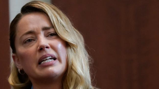 Amber Heard testifies at Fairfax County Circuit Court during a defamation case against her by Depp. (Photo by ELIZABETH FRANTZ / POOL / AFP)