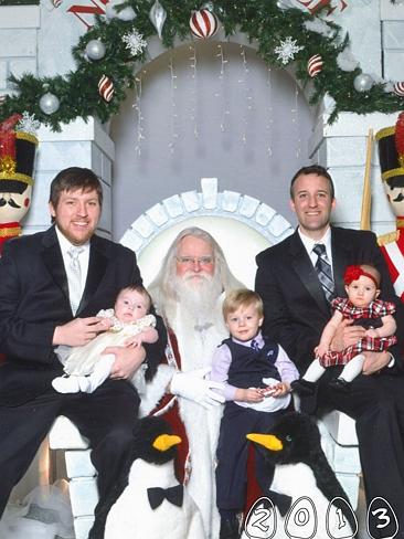 Thirty four years on Santa's lap ... Martin and Mike Gray are still taking photos as part of their family tradition. Picture:...