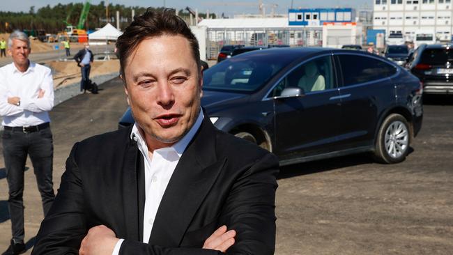 Tesla CEO Elon Musk talks to media as he arrives to visit the construction site of the future US electric car giant Tesla. Picture: AFP