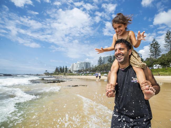 Tony Rehal from Brisbane enjoys Fathers day at the beach with his 5 year old daughter Kyah at Mooloolaba. Photo Lachie Millard