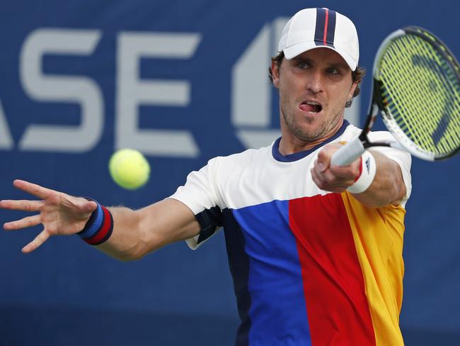 Mischa Zverev, of Germany, returns a shot from Thai-Son Kwiatkowski.