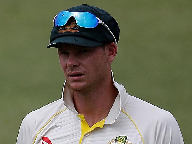 (FILES) This file photo taken on March 05, 2018 shows Australia cricketer David Warner and team captain Steven Smith leavin the field at the end of play in the fifth and final day of of the first Sunfoil cricket Test match between South Africa and Australia at the Kingsmead Stadium in Durban Cricket Australia confirmed one year bans for Steve Smith and David Warner on March 28, 2018, following revelations concerning ball-tampering. / AFP PHOTO / MARCO LONGARI