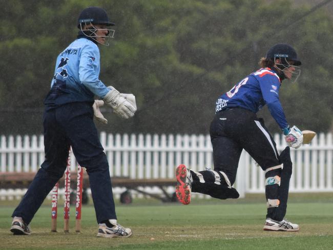 Aston Weir plays a shot in the rain. Picture: Sean Teuma