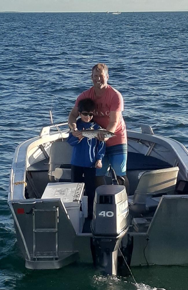 Samuel, along with dad Paul Miller celebrates catching his first mackerel.