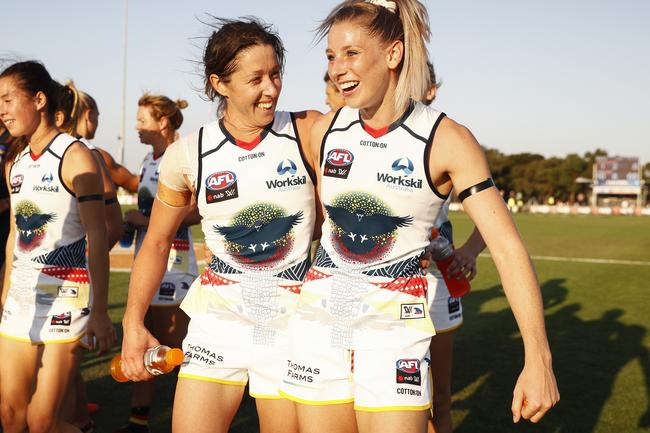 Crows players celebrate the win against the Melbourne Demons at Casey Fields in Melbourne.