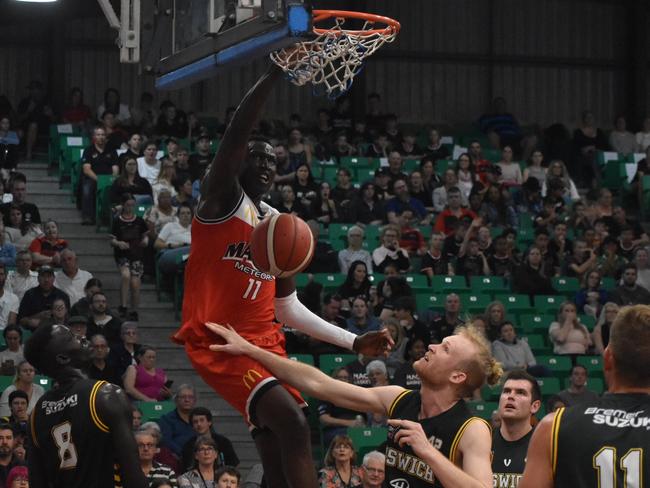 Emmanuel Malou throws down a dunk for Mackay Meteors against Ipswich Force in the NBL1 North match, July 24 2021. Picture: Matthew Forrest