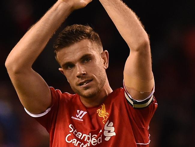 Liverpool's English midfielder Jordan Henderson applauds supporters at the final whistle in the English Premier League football match between Liverpool and Newcastle United at Anfield in Liverpool, north west England on April 13, 2015. Liverpool won the game 2-0. AFP PHOTO / PAUL ELLIS RESTRICTED TO EDITORIAL USE. NO USE WITH UNAUTHORIZED AUDIO, VIDEO, DATA, FIXTURE LISTS, CLUB/LEAGUE LOGOS OR “LIVE” SERVICES. ONLINE IN-MATCH USE LIMITED TO 45 IMAGES, NO VIDEO EMULATION. NO USE IN BETTING, GAMES OR SINGLE CLUB/LEAGUE/PLAYER PUBLICATIONS.