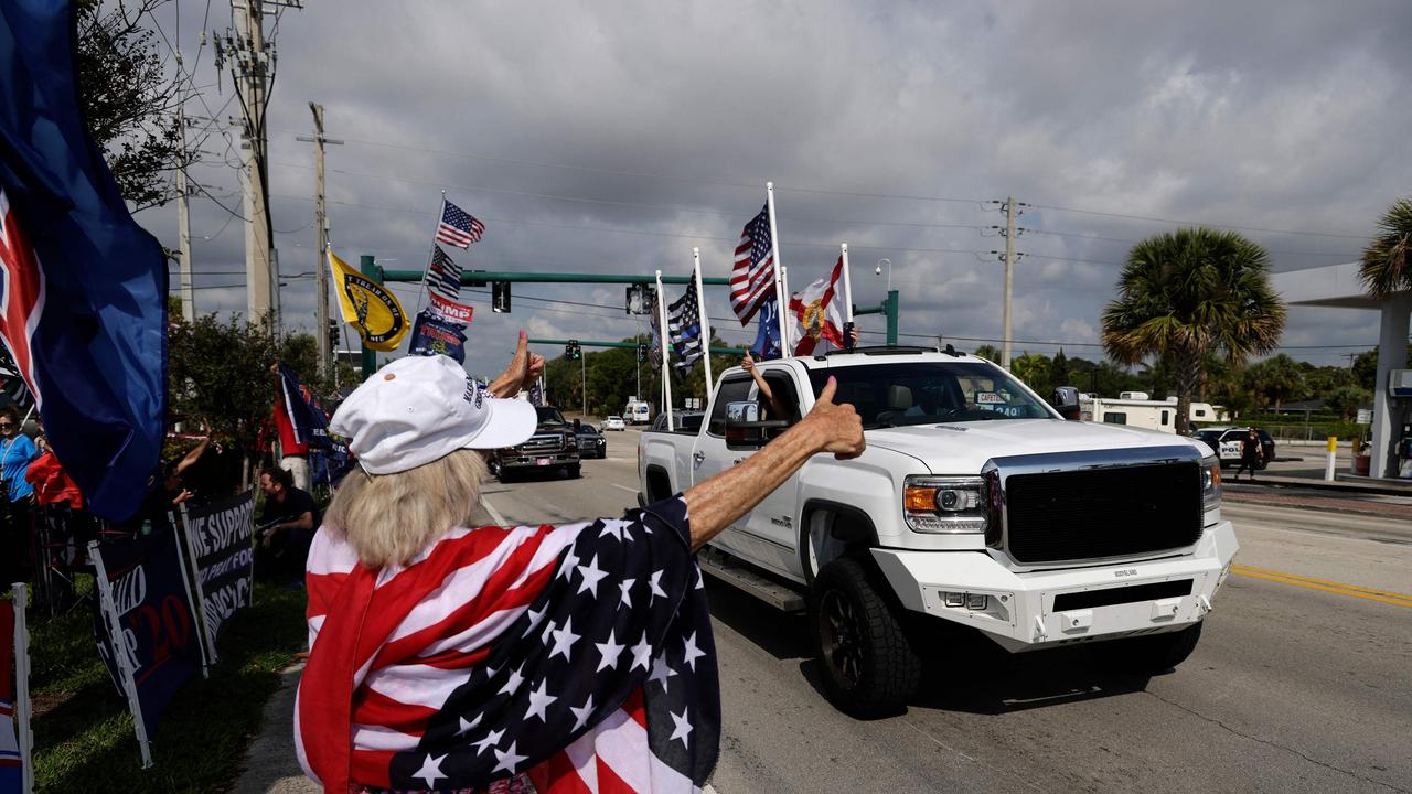 Trump supporters line the streets as the former president’s motorcade received blanket media coverage not seen since the OJ Simpson chase. Picture: AFP