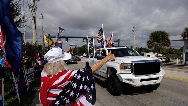 Trump supporters line the streets as the former president’s motorcade received blanket media coverage not seen since the OJ Simpson chase. Picture: AFP