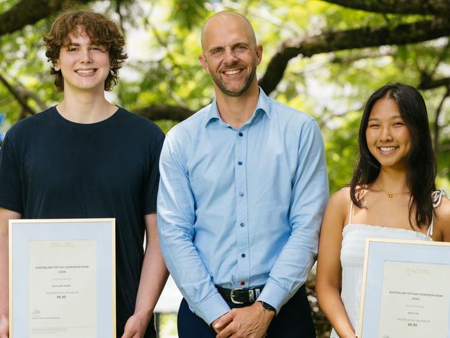 QTAC chief executive Chris Veraa with Kelvin Grove State College student Lachlan Howie, 17, and Brisbane Girls Grammar School student Kaiyu Su, 17. Picture: Supplied