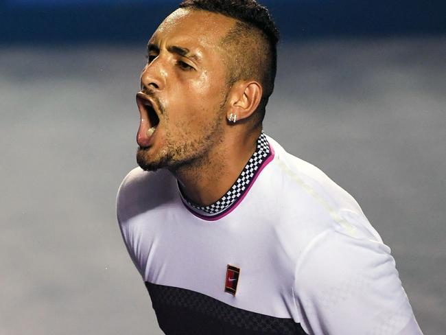 Australian tennis player Nick Kyrgios celebrates his victory after beating Spanish tennis player Rafael Nadal during their Mexico ATP 500 Open men's single tennis match in Acapulco, Guerrero state, Mexico on February 27, 2019. (Photo by PEDRO PARDO / AFP)