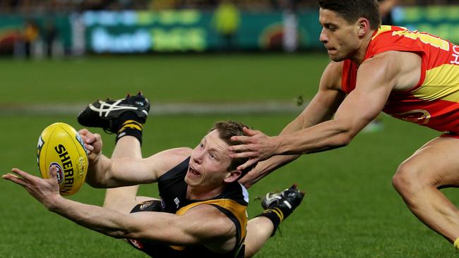 Dion Prestia in action for the Suns last year — battling against new teammate Dylan Grimes. Picture: Colleen Petch