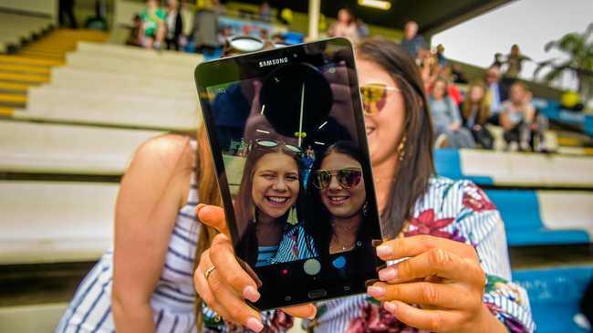 Maddie Tomlinson and Darcy Cromack try out the Samsung Galaxy tablet. Picture: Adam Hourigan