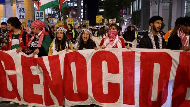 Teachers have been asked not to bring political signage into clasrooms, like the ones seen in this march in San Francisco. Picture: