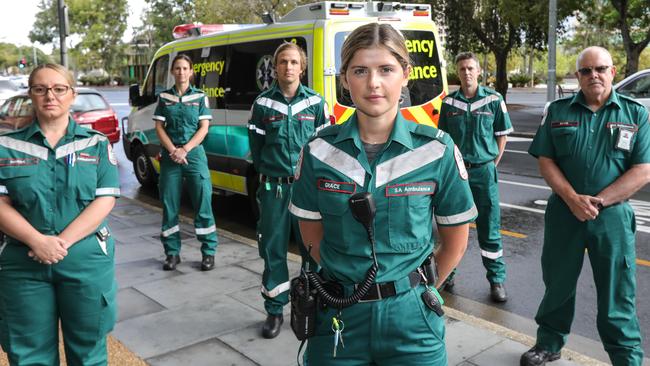 New Paramedic Grace Williams surrounded by fellow paramedics Marisa D’Annunzio, Claire Toms, Sam Papini, Sam Keogh and SA Ambulance CEO David Place. Picture: AAP / Russell Millard