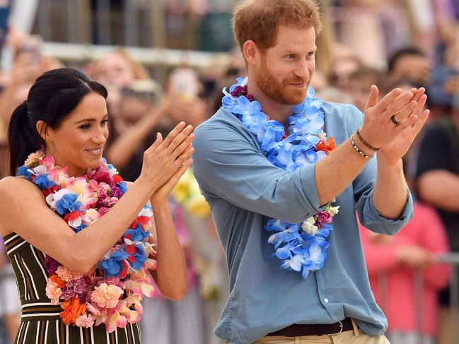 Prince Harry and his wife Meghan at Bondi today. Picture: AFP