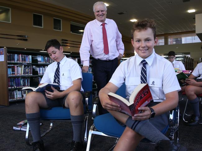 15/02/2019. (Front L-R) Oliver Ferguson, Headmaster Tim Wright and Angus Molchanoff and  (back L-R) Charlie Ashton, Oliver Robinson (yr12) and Tom Galligan. Year 8 students reading in the library at Shore School in North Sydney. SHORE headmaster Tim Wright has urged kids to get off social media and read more widely, warning that they risked growing up with limited and superficial knowledge of the world unless they extended themselves. Britta Campion / The Australian