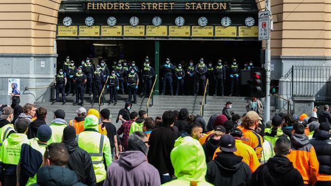 Police guard the entrance to Flinders Street Station. Picture: Getty Images