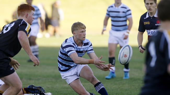 GPS1's Hugo Orpin offloads the ball in the match with ISA.