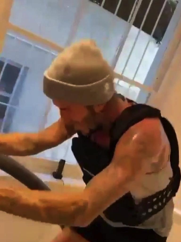 The football hunk can be seen sweating on a treadmill. Picture: davidbeckham/Instagram