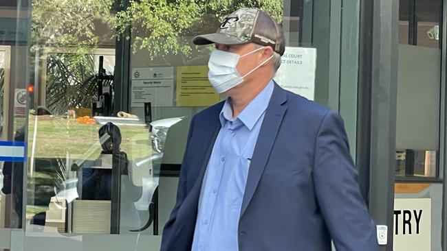 Shayne Wood tried to avoid media as he left Sutherland Local Court. Picture: Ashleigh Tullis