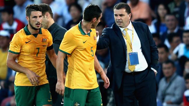 Postecoglou speaks to Mark Milligan during Australia’s first qualifier of this campaign back on June 16, 2015, in Bishkek, Kyrgyzstan. Picture: Getty Images