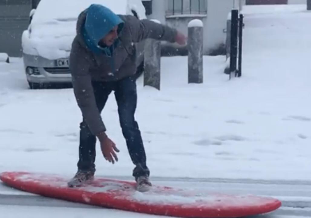 Snow Doesn't Stop Keen Surfer in Biarritz