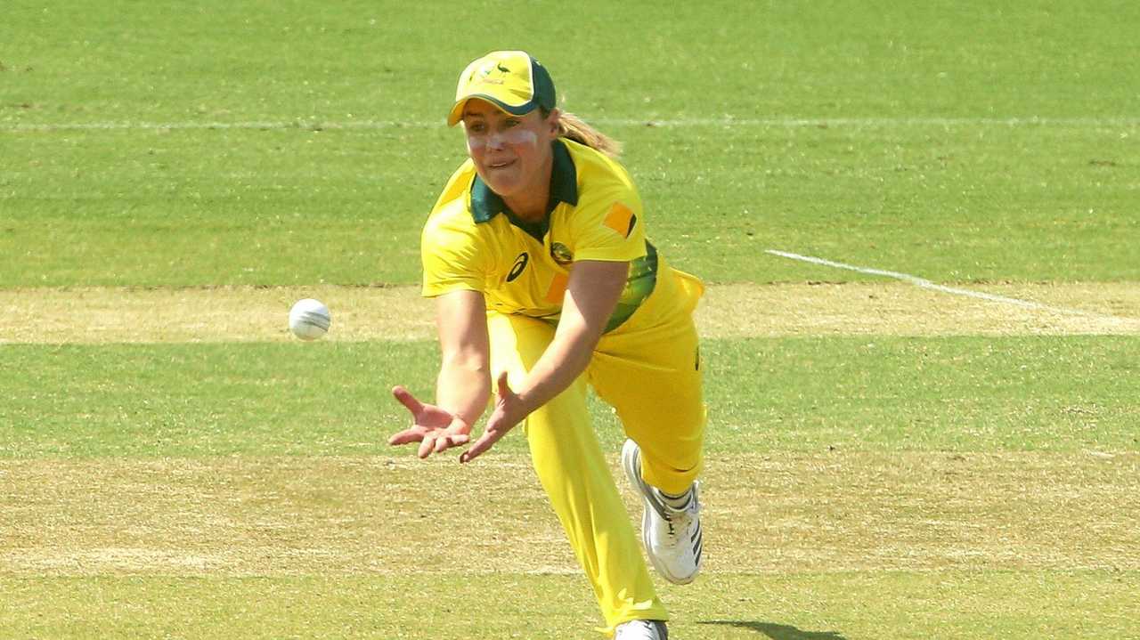 Ellyse Perry of Australia takes a catch to dismiss Lauren Down of New Zealand. Picture: HAMISH BLAIR