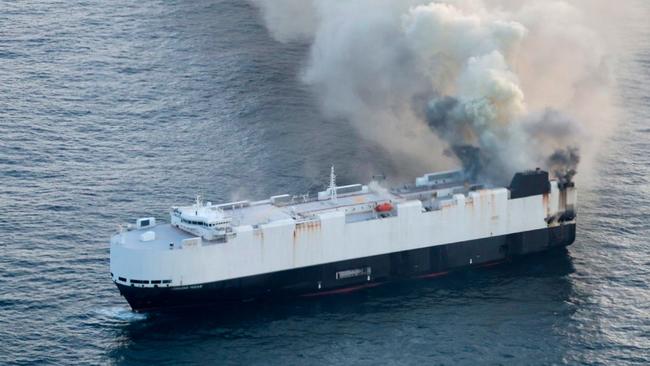 In this photo provided by the U.S. Coast Guard, smoke rises from cargo vessel Morning Midas approximately 300 miles south of Adak, Alaska, June 3, 2025, as the crew of a cargo ship carrying around 3,000 vehicles to Mexico, abandoned ship after they could not control a fire. (U.S. Coast Guard/Courtesy Air Station Kodiak via AP)