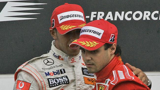 McLaren Mercedes Formula One driver Lewis Hamilton of Britain, left, talks to Ferrari Formula One driver Felipe Massa of Brazil on the podium after the Belgian F1 Grand Prix in Spa-Francorcamps, Belgium, Sunday, Sept 7, 2008. Ferrari's Felipe Massa has been declared the winner of the Belgian Grand Prix after McLaren driver Lewis Hamilton was given a 25-second penalty for an illegal maneuver. Hamilton had finished first Sunday after dramatically overtaking Ferrari's Kimi Raikkonen, but race stewards said he had cut across a chicane to gain an advantage before passing the defending world champion. AP (Photo: Frank Augstein)