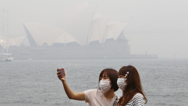 People are being urged to wear P2 masks while outside or to stay indoors as the haze worsens by the hour. Picture: John Appleyard