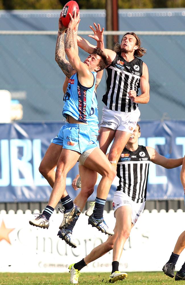 Jake Sutcliffe marks in front of Port Adelaide’s Jarrod Lienert Picture: STEPHEN LAFFER