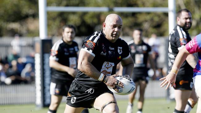 Redfern's Christopher Carr with the ball. Picture: John Appleyard